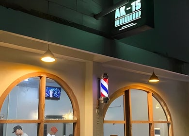 Exterior of Barbershop AK-15, Nusa Tenggara Barat featuring traditional barber pole.