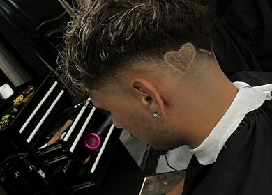 Modern heart-shaped fade haircut at Barbershop AK-15, Nusa Tenggara Barat, ID.