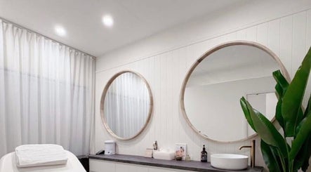 Bright spa room at SOL HAUS BEAUTY & WELLNESS, Burleigh Heads, Queensland, AU, highlighting modern decor and mirrors.