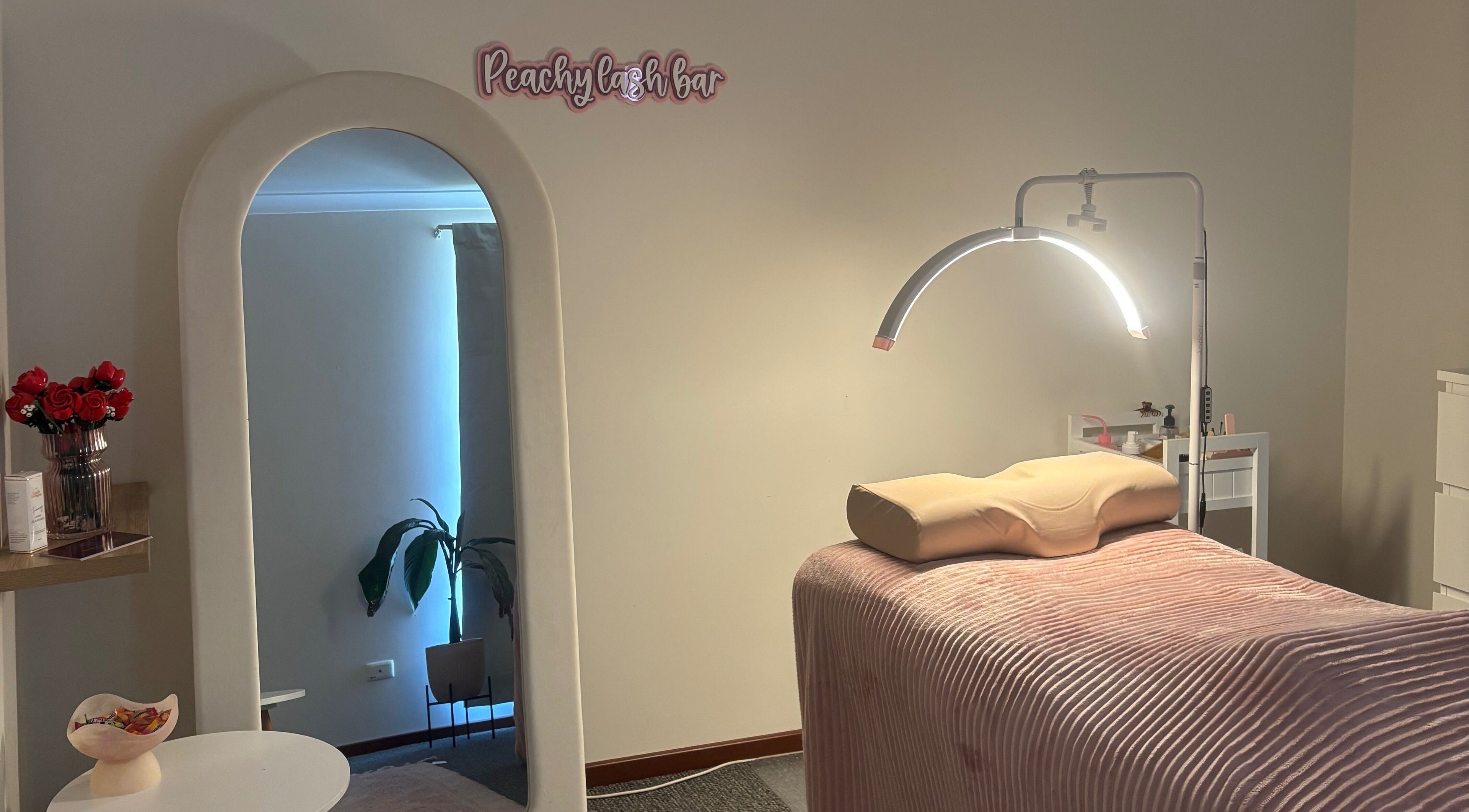 Cozy treatment room at Peachy Lash Bar, Ballajura, WA, AU, featuring a plush bed and elegant decor.