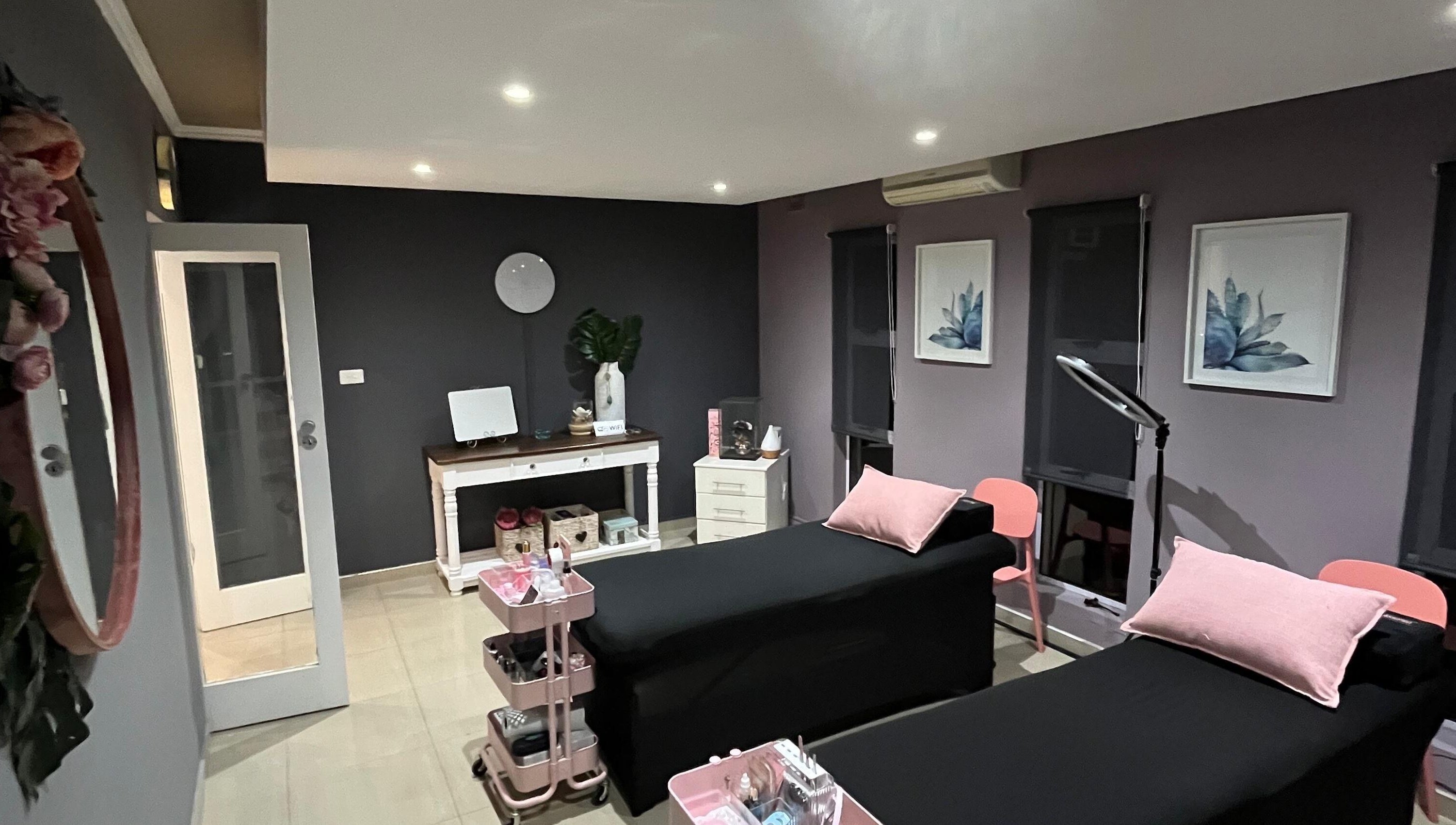 Relaxing treatment room at Jackie Bee Aesthetics, Ballito, Kwazulu-natal, ZA with elegant decor and cozy beds.
