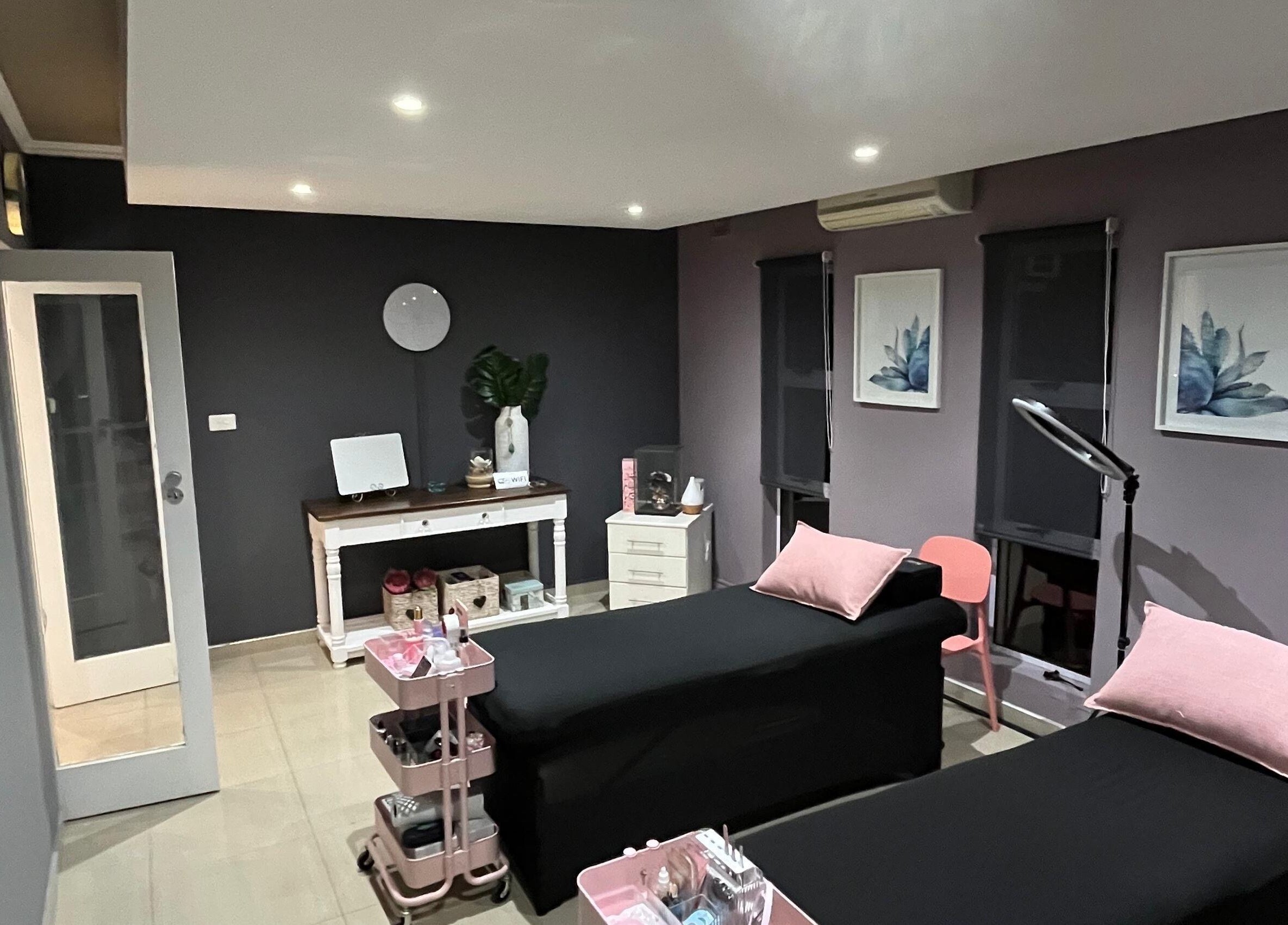 Relaxing treatment room at Jackie Bee Aesthetics, Ballito, Kwazulu-natal, ZA with elegant decor and cozy beds.