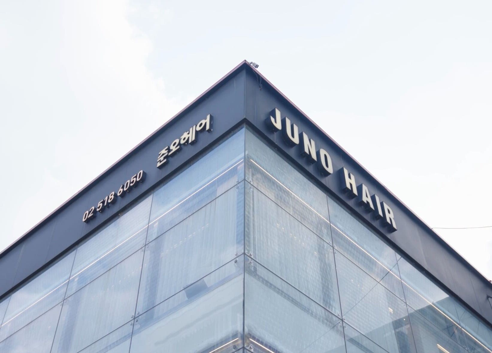 Exterior of 준오헤어 압구정로데오１호점, Seoul, showcasing modern architecture and signage.
