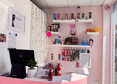 Elegant reception area at Sevens with beauty products on display shelves, Cardiff, Wales, GB.