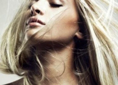 Close-up of blonde hair styled at Scott’s Hairdressing, Glasgow, Scotland, GB, showcasing sleek beauty.