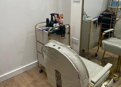 Stylish salon chair and hairdressing tools at Hijabi Hair, Bristol, England, GB.