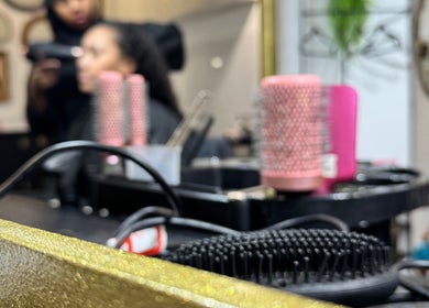 Styled hair with professional tools at Hijabi Hair, Bristol, England, GB. Experience quality haircare services.