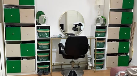 Dexters Lab beauty workspace in London, England, GB with chair and organized storage.