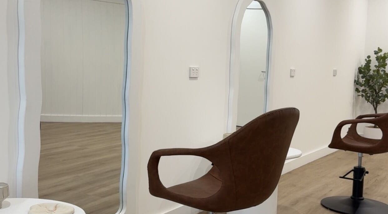 Modern salon interior at Hair By Sarah Jane, Mudgee, New South Wales, AU, featuring elegant styling chairs.