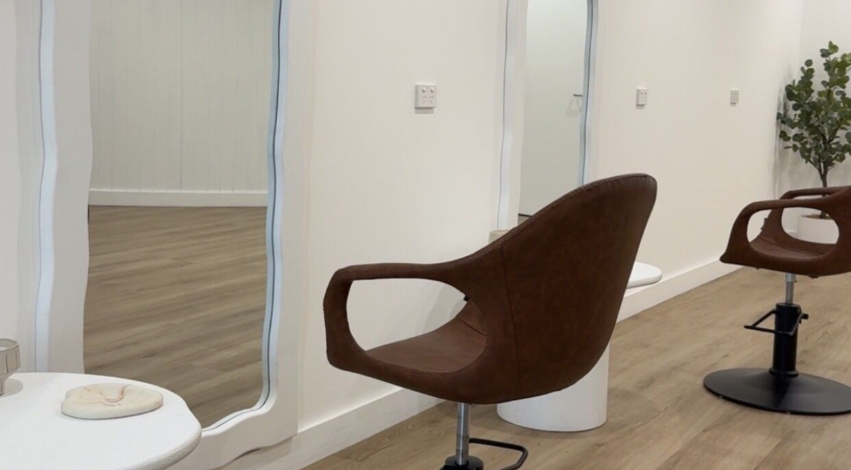 Modern salon chair and wavy mirror at Hair By Sarah Jane, Mudgee, New South Wales, AU.