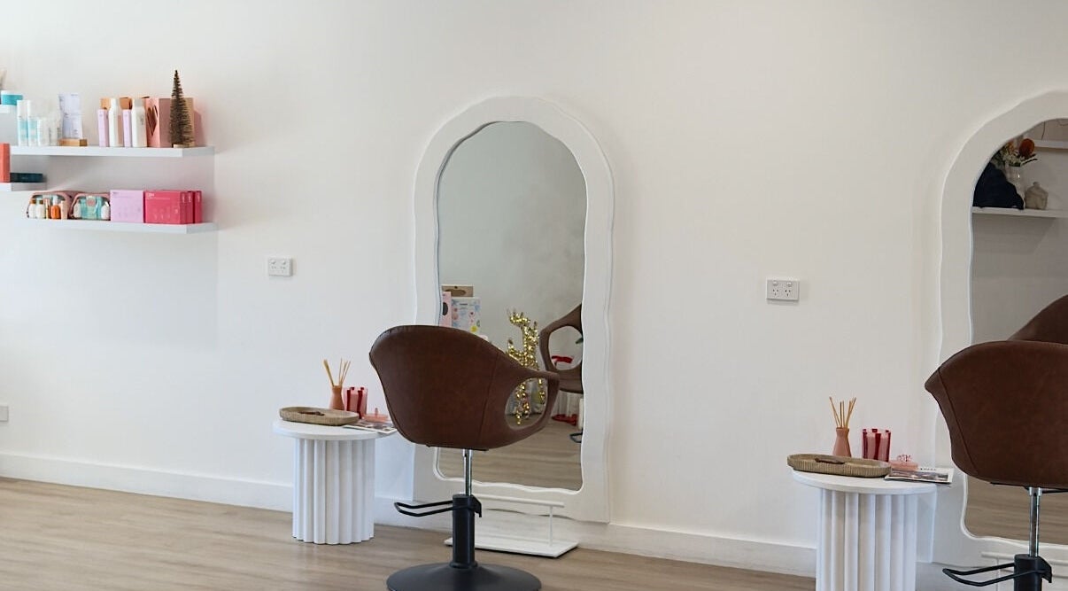 Stylish salon station at Hair By Sarah Jane, Mudgee, New South Wales, AU with mirror and seating.