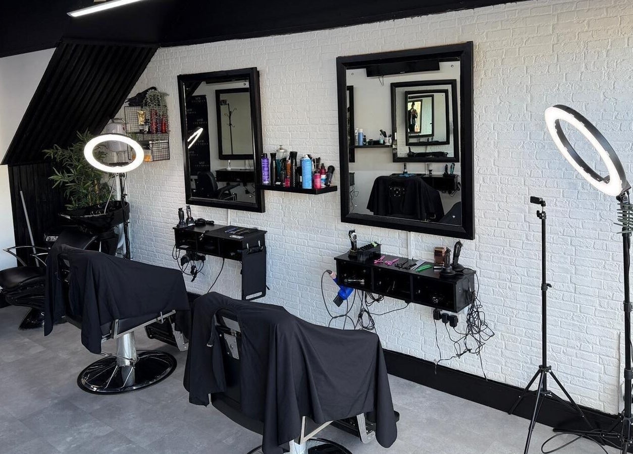 Modern salon interior at Blake Company, Kenilworth, England, GB with chic styling stations and professional lighting.