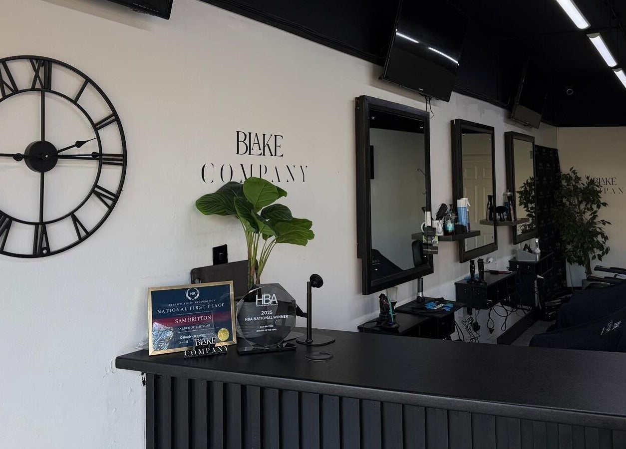 Reception area of Blake Company in Kenilworth, England, featuring a stylish decor and award display.