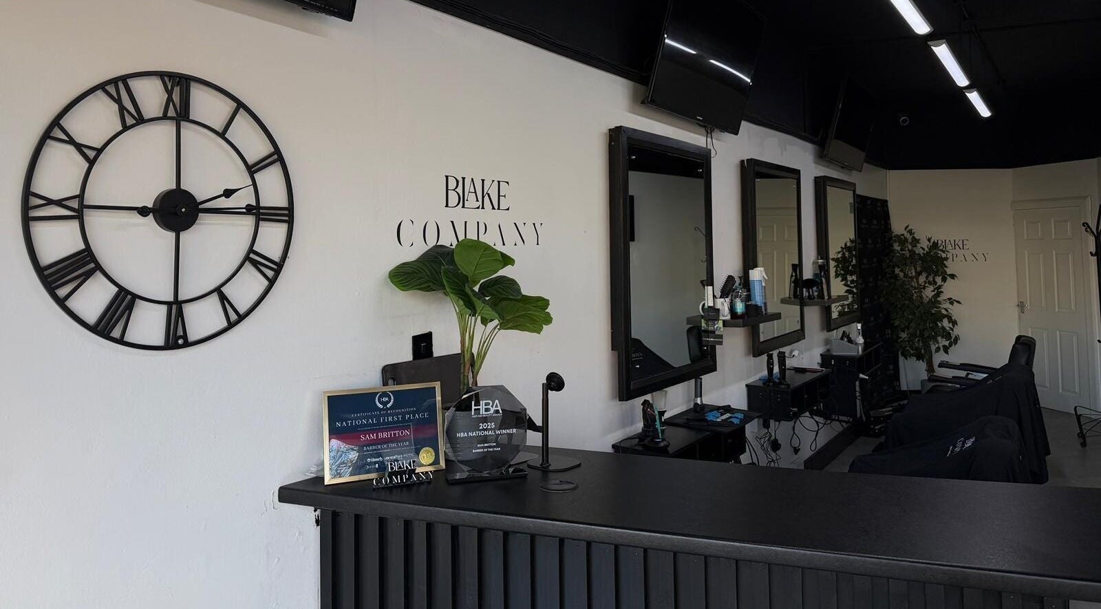 Reception area of Blake Company in Kenilworth, England, featuring a stylish decor and award display.