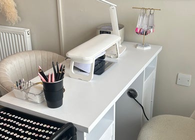 Elegant nail station at Nails by Norrie, Caernarfon, Cymru, GB, featuring tools and manicure display.