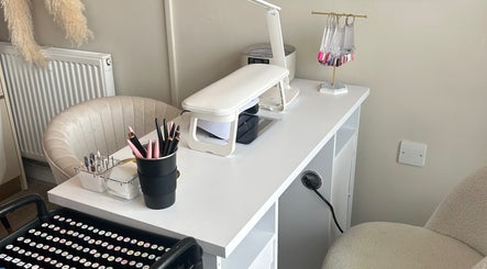 Elegant nail station at Nails by Norrie, Caernarfon, Cymru, GB, featuring tools and manicure display.