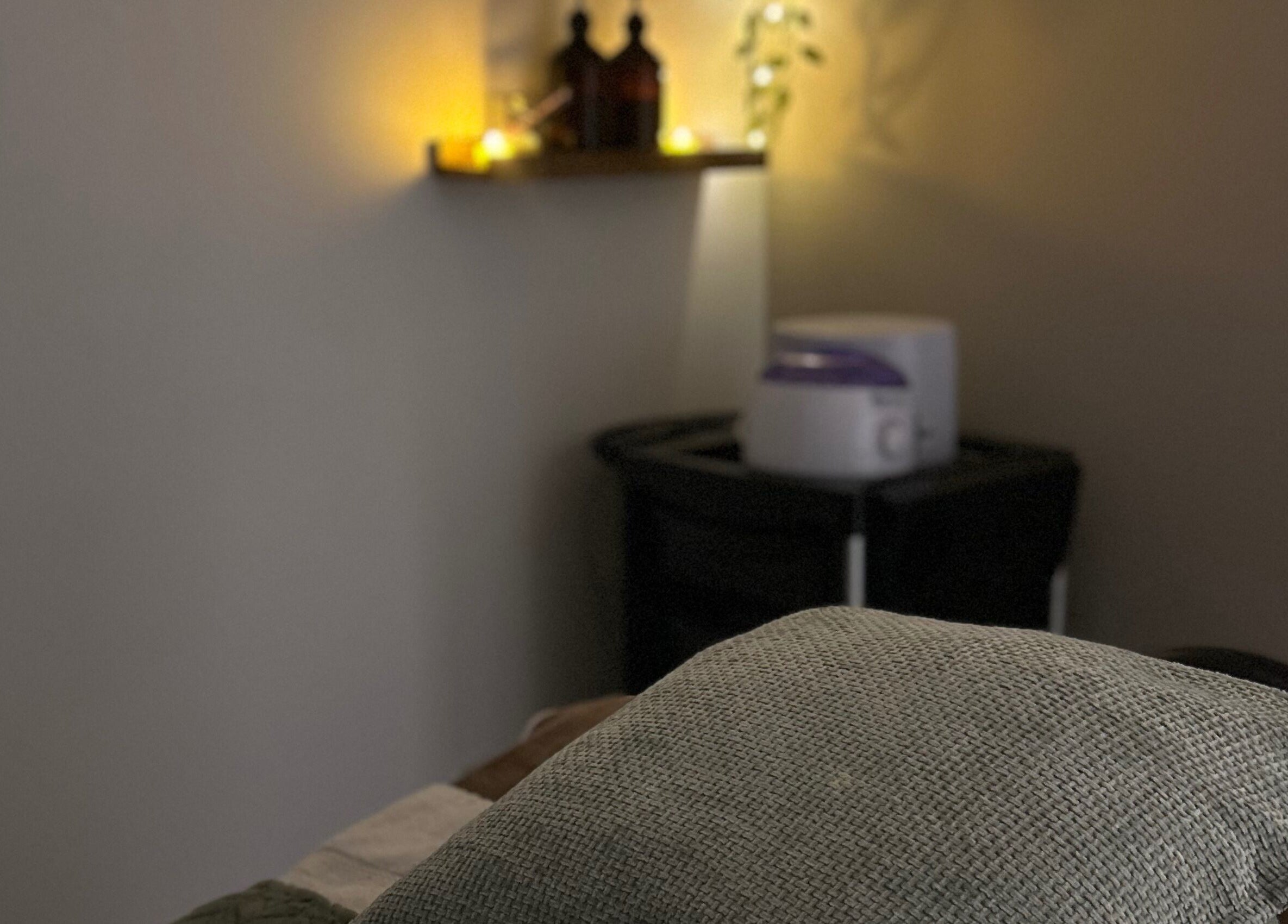 Tranquil spa room at Sophie’s Ultimate Beauty, Deeping Saint James, England, GB with soft lighting.