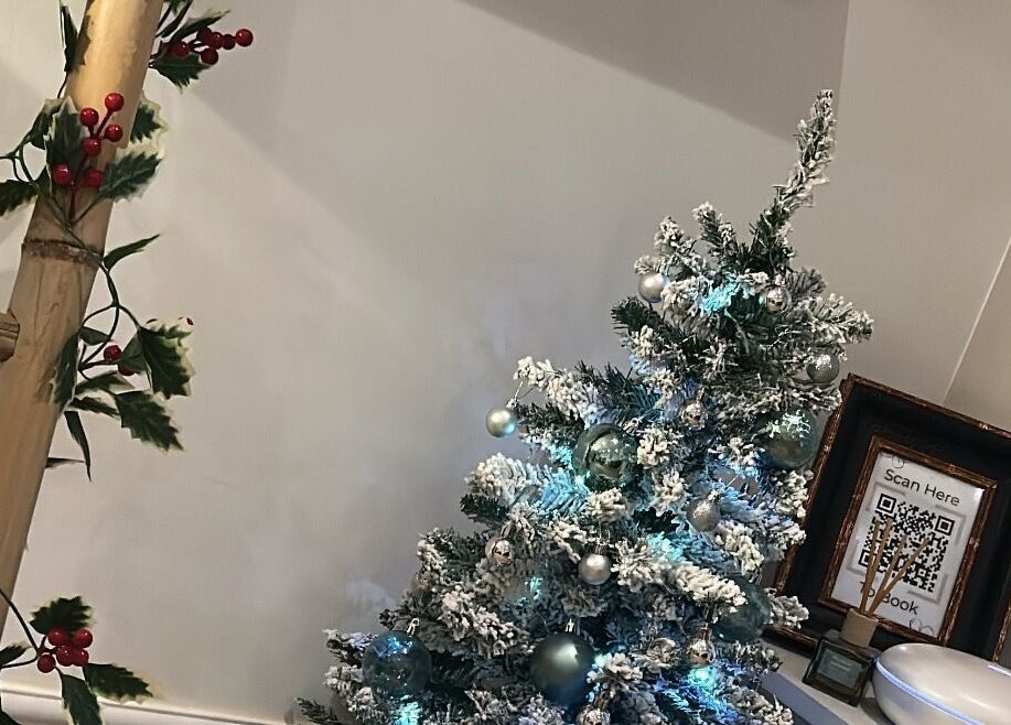 Cozy Christmas decor at Sophie's Ultimate Beauty in Deeping Saint James, England, GB.