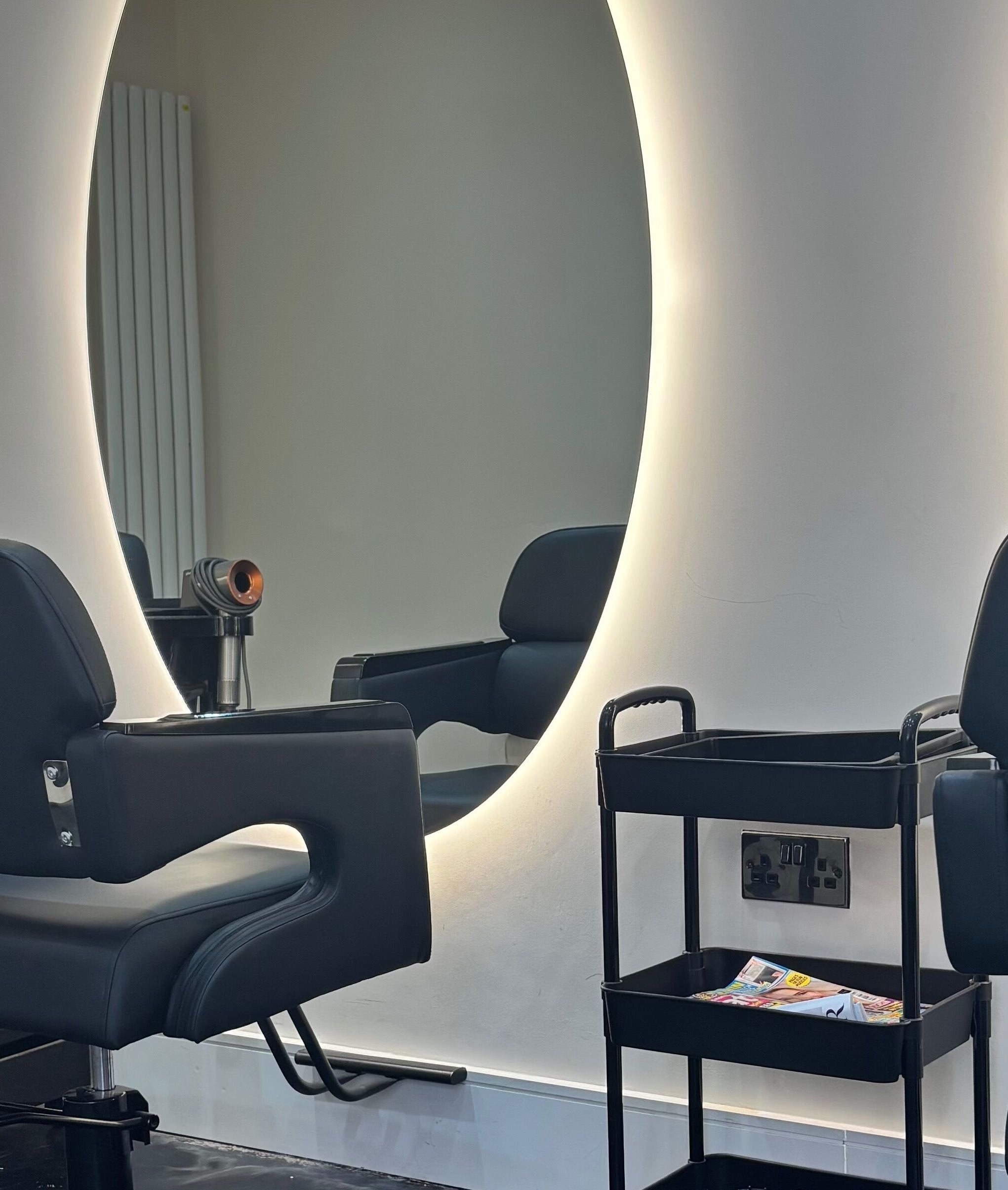 Stylish salon chairs and illuminated mirrors at Hair by Shannon Summers, Leicester, England, GB.