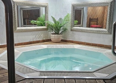 Luxurious hot tub at Peterstone Court Country House & Spa, Llanhamlach, Wales, GB offers ultimate relaxation.
