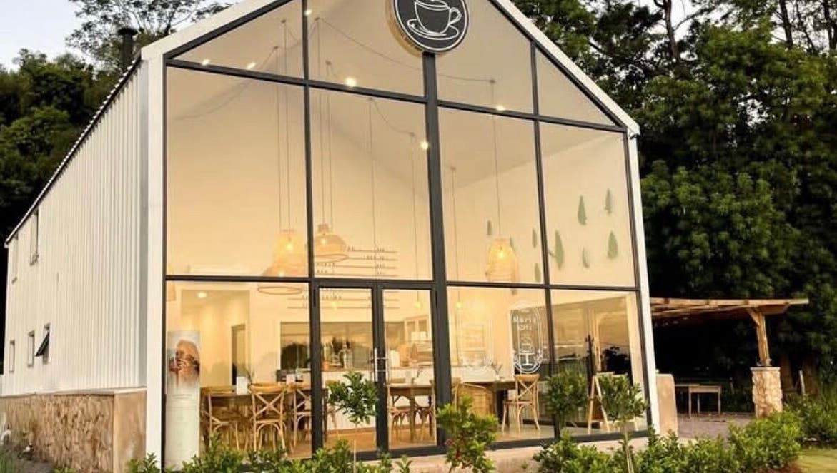 Modern facade of Rovel Beauty Studio Rayton in Rayton, Gauteng, ZA with inviting interior lighting.