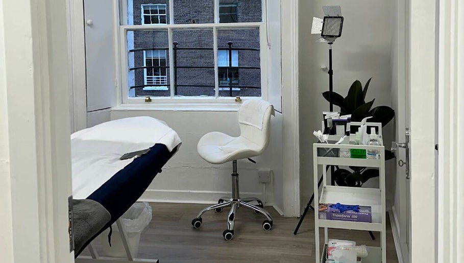 Serene treatment room at Nonna Skincare in Dublin, County Dublin, IE, featuring a modern aesthetic and tranquil ambiance.