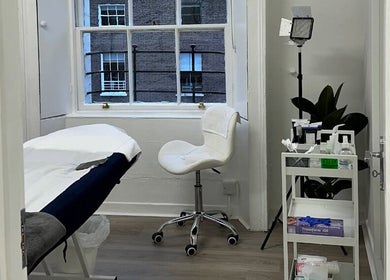 Serene treatment room at Nonna Skincare in Dublin, County Dublin, IE, featuring a modern aesthetic and tranquil ambiance.