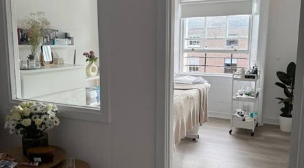 Tranquil treatment room at Nonna Skincare, Dublin, County Dublin, IE, featuring elegant decor and a cozy bed.