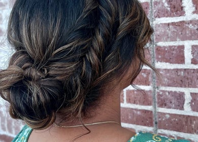 Stylish braided updo at Divine Beauty Parlor, San Antonio, Texas, US, showcasing expert hairstyling.