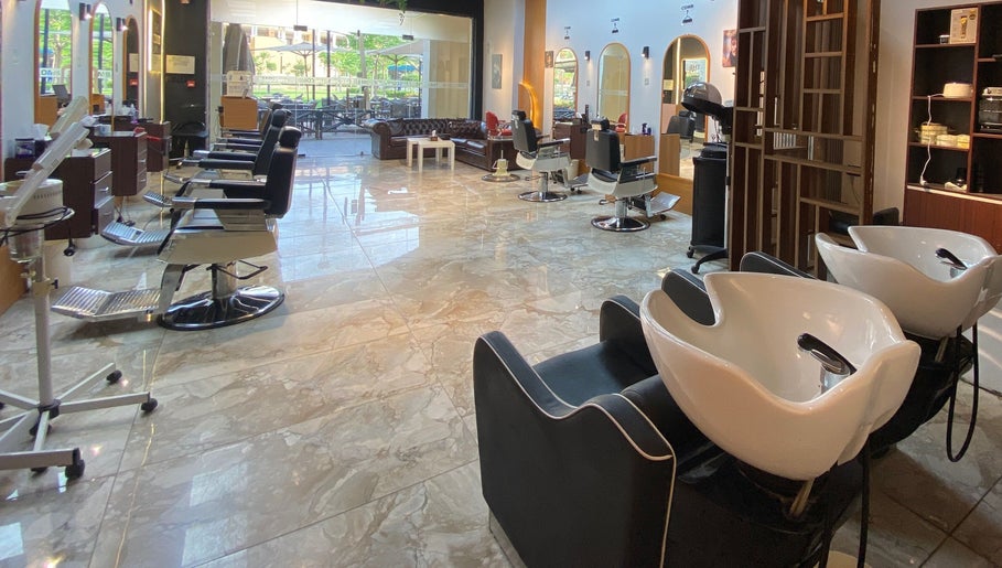 Modern interior of The Comb Salon in Cairo Governorate, Cairo Governorate, EG with sleek styling chairs.