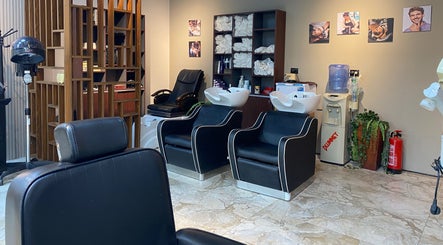 Modern salon setup at The Comb Salon, Cairo Governorate, EG with chairs and stylish decor.