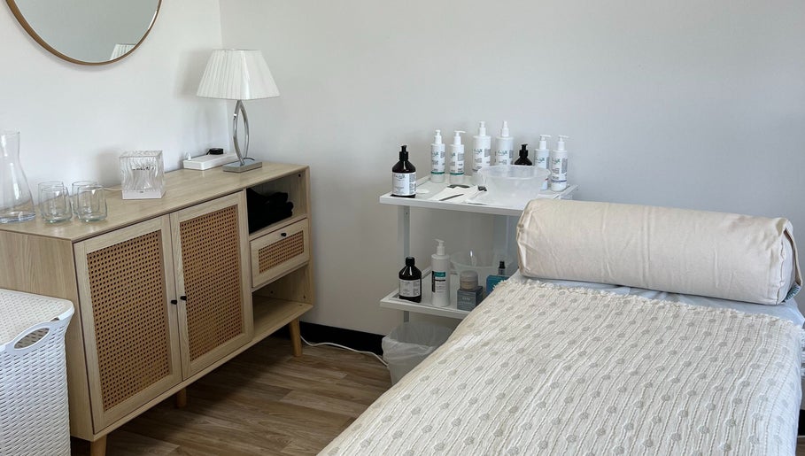 Tranquil treatment room at Niche Beauty by Lisa in Rochester, England, GB, featuring a cozy massage bed.