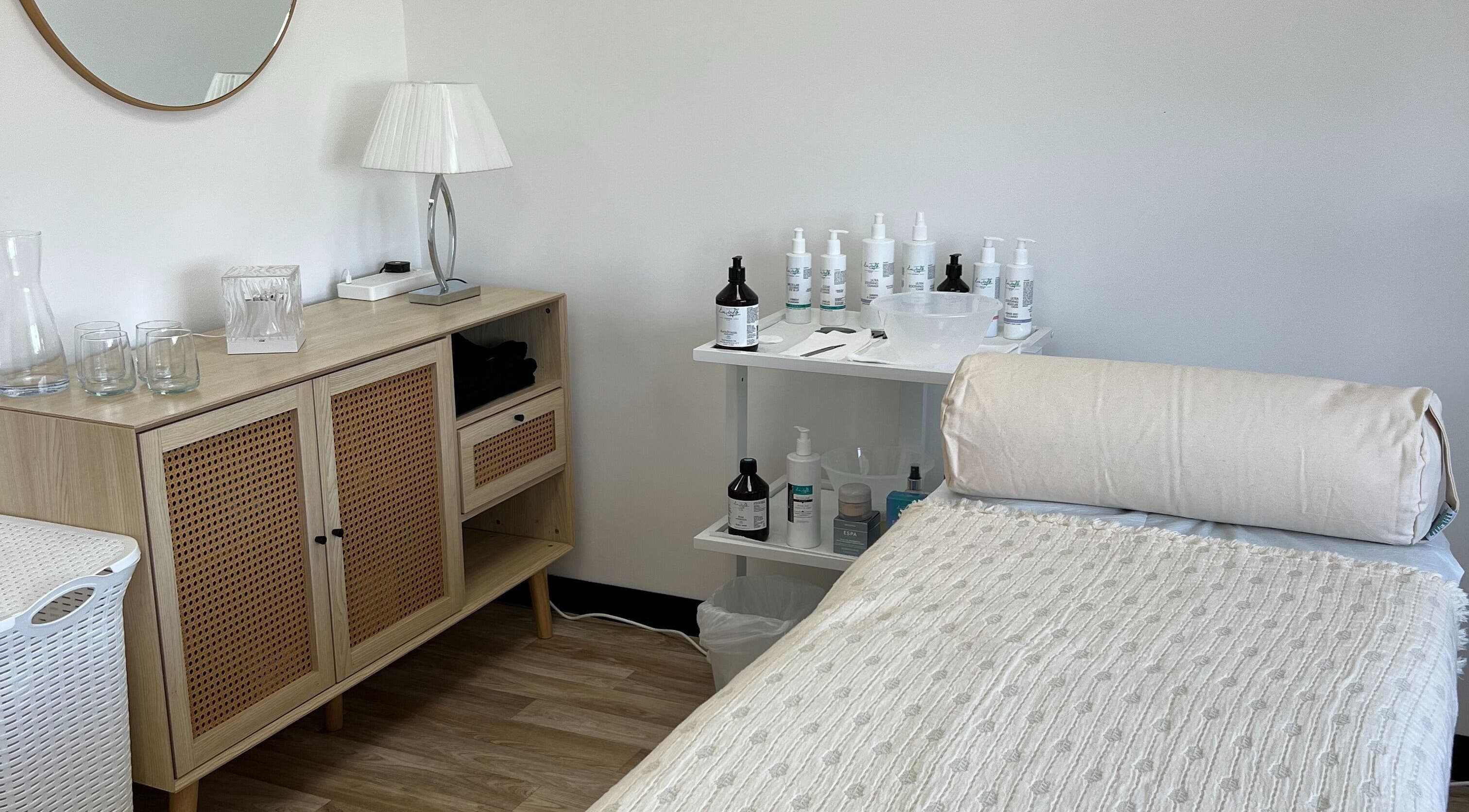 Tranquil treatment room at Niche Beauty by Lisa in Rochester, England, GB, featuring a cozy massage bed.