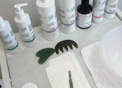 Niche Beauty by Lisa skincare products and tools on a white table in Rochester, England, GB.