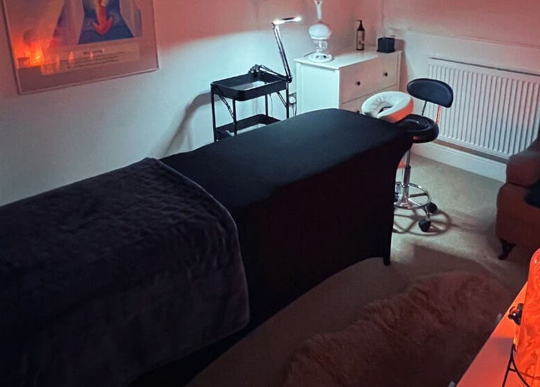 Relaxing therapy room setup at Face Spa in Hastings, England, GB with ambient lighting.