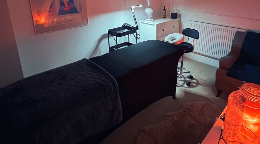 Relaxing therapy room setup at Face Spa in Hastings, England, GB with ambient lighting.