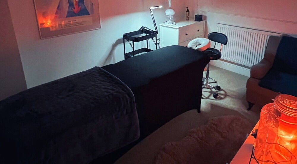 Relaxing therapy room setup at Face Spa in Hastings, England, GB with ambient lighting.