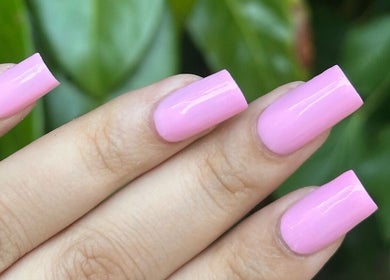 Manicured hand with pink nails from Klaw Cartel in Birmingham, England, GB.