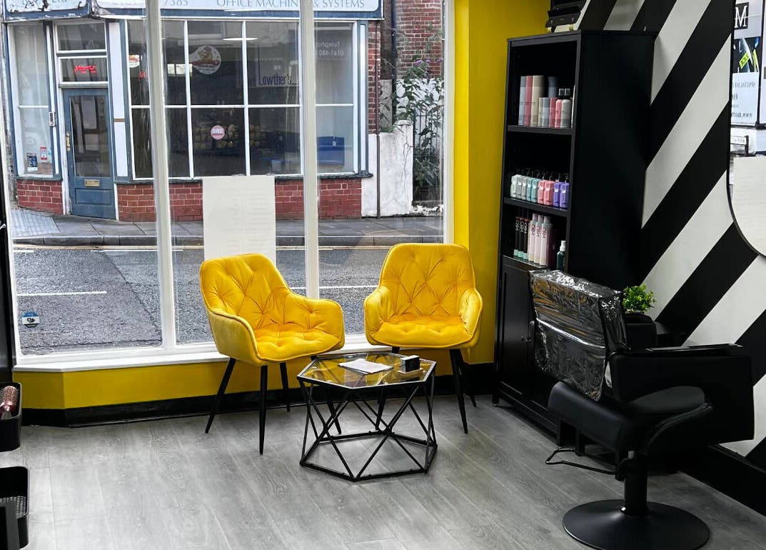 Chic sitting area with yellow chairs in MMS Mattys Mane Studio, Stockport, England, GB.