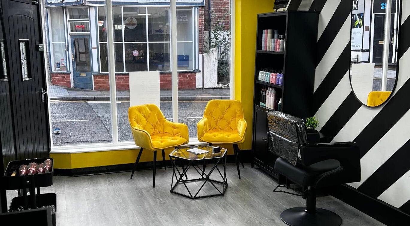 Chic sitting area with yellow chairs in MMS Mattys Mane Studio, Stockport, England, GB.