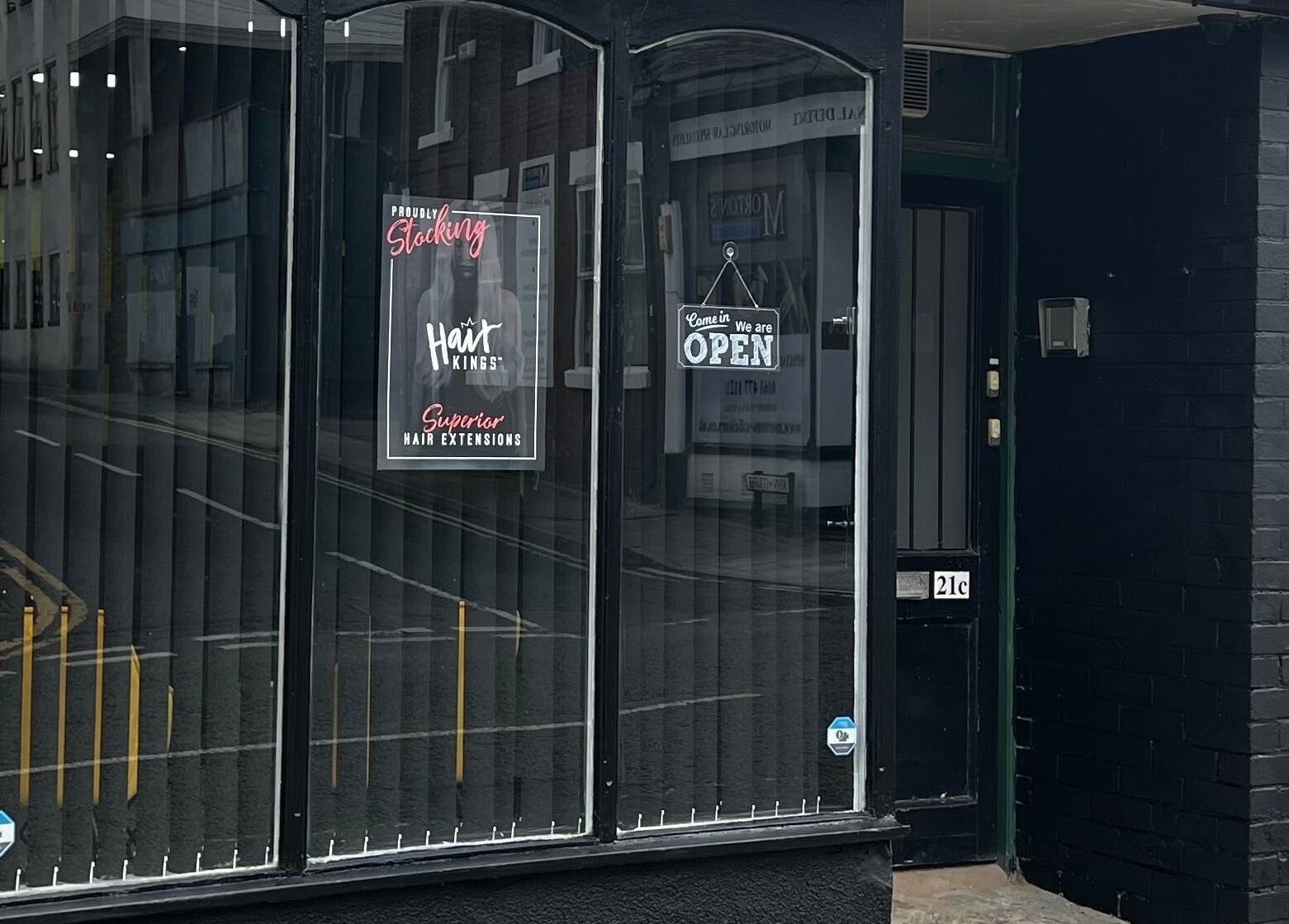 MMS Mattys Mane Studio entrance showcasing stylish window display in Stockport, England, GB.