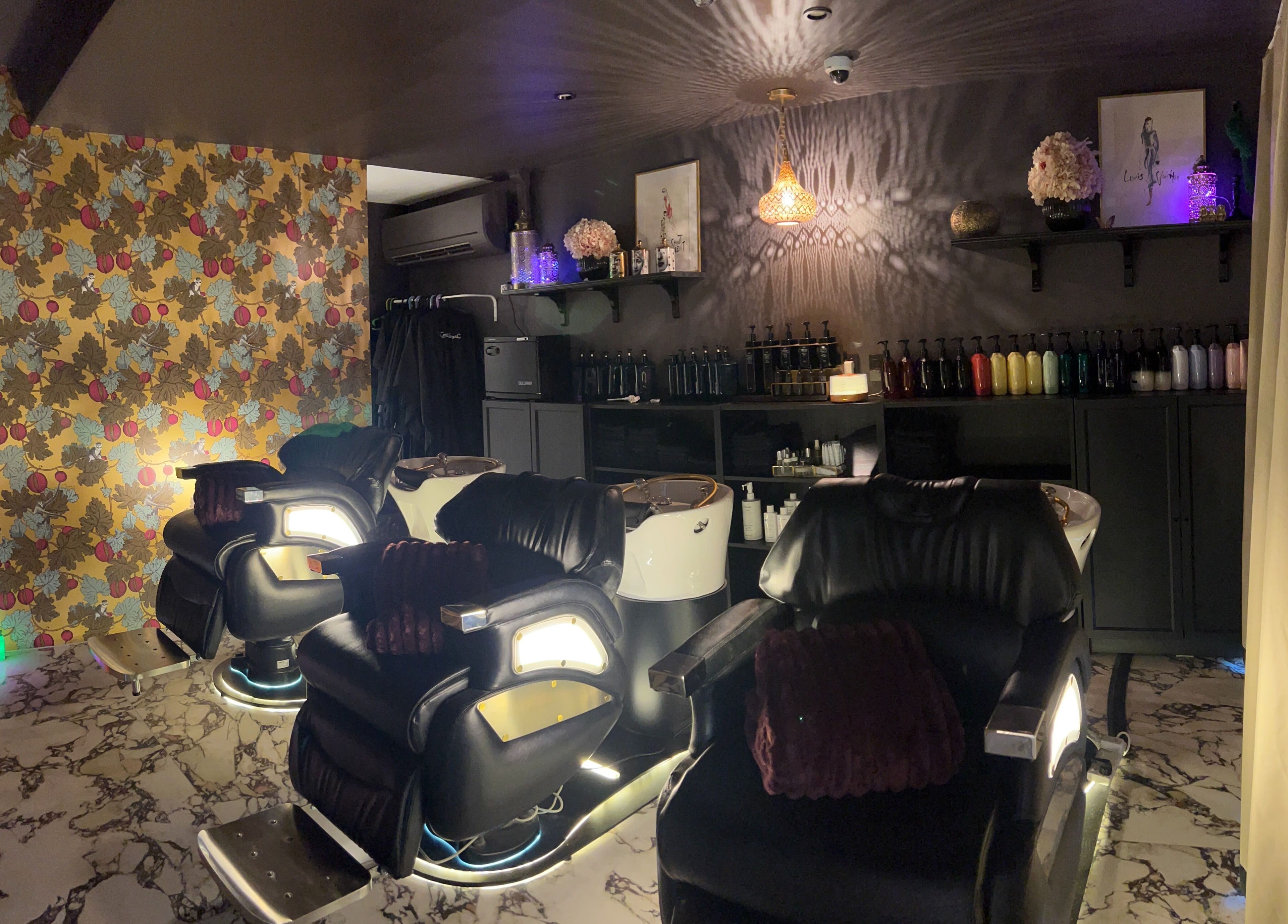 Luxurious salon chairs in a stylish setting at Kaitlyn Wagner Hairdressing, Hawthorne, Queensland, AU.