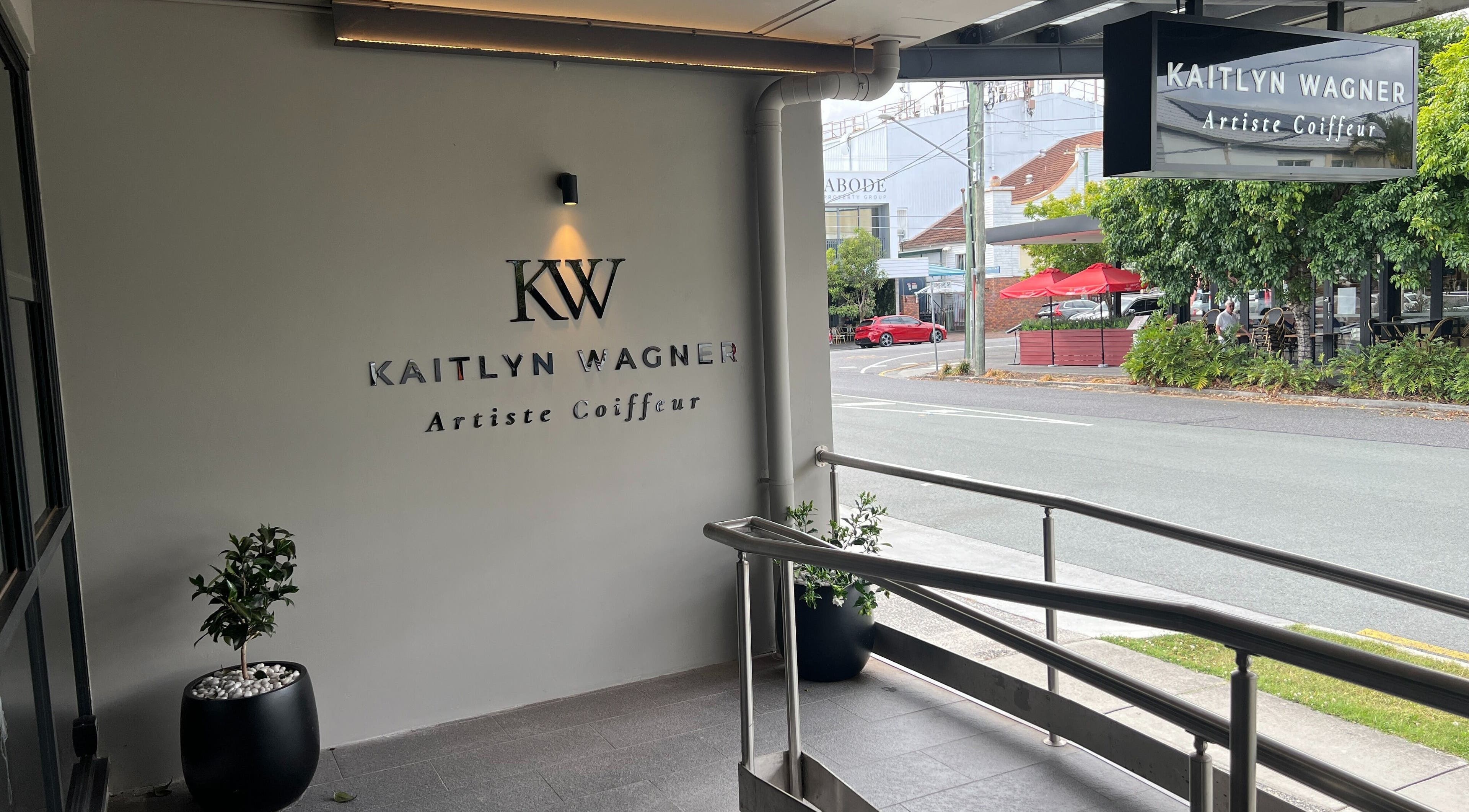 Elegant entrance of Kaitlyn Wagner Hairdressing in Hawthorne, Queensland, AU, showcasing modern design.
