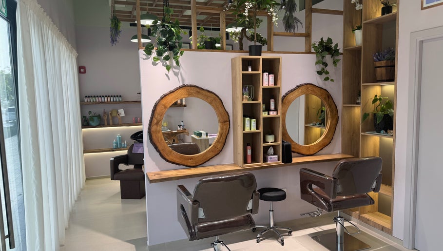 Chic salon interior with wooden mirrors and styling chairs at Lavender Moon Ladies Salon, Dubai, AE.