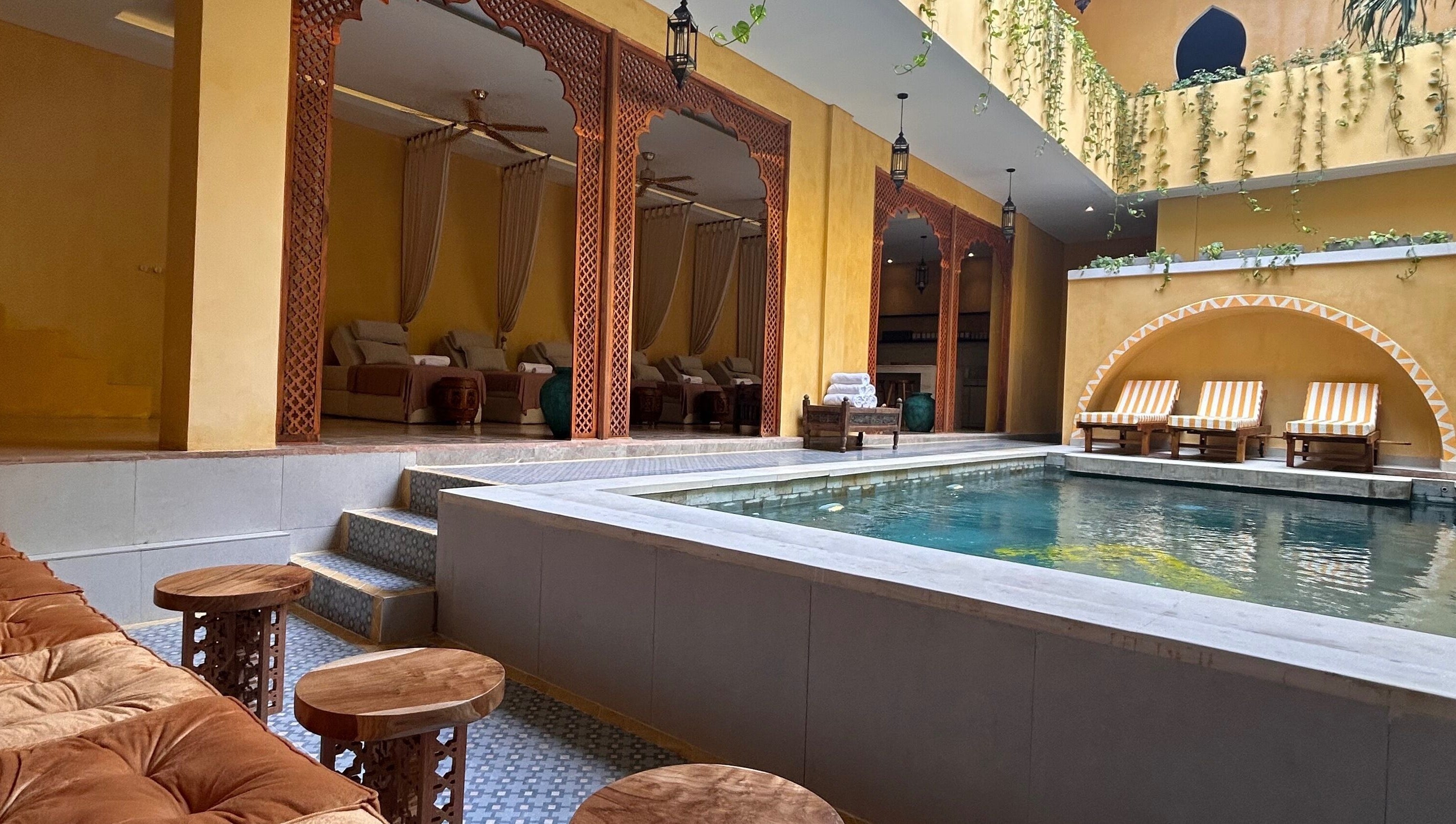 Luxurious poolside view at Limu Spa Moroccan in Bali, Bali, ID, showcasing elegant lounging areas and serene ambiance.