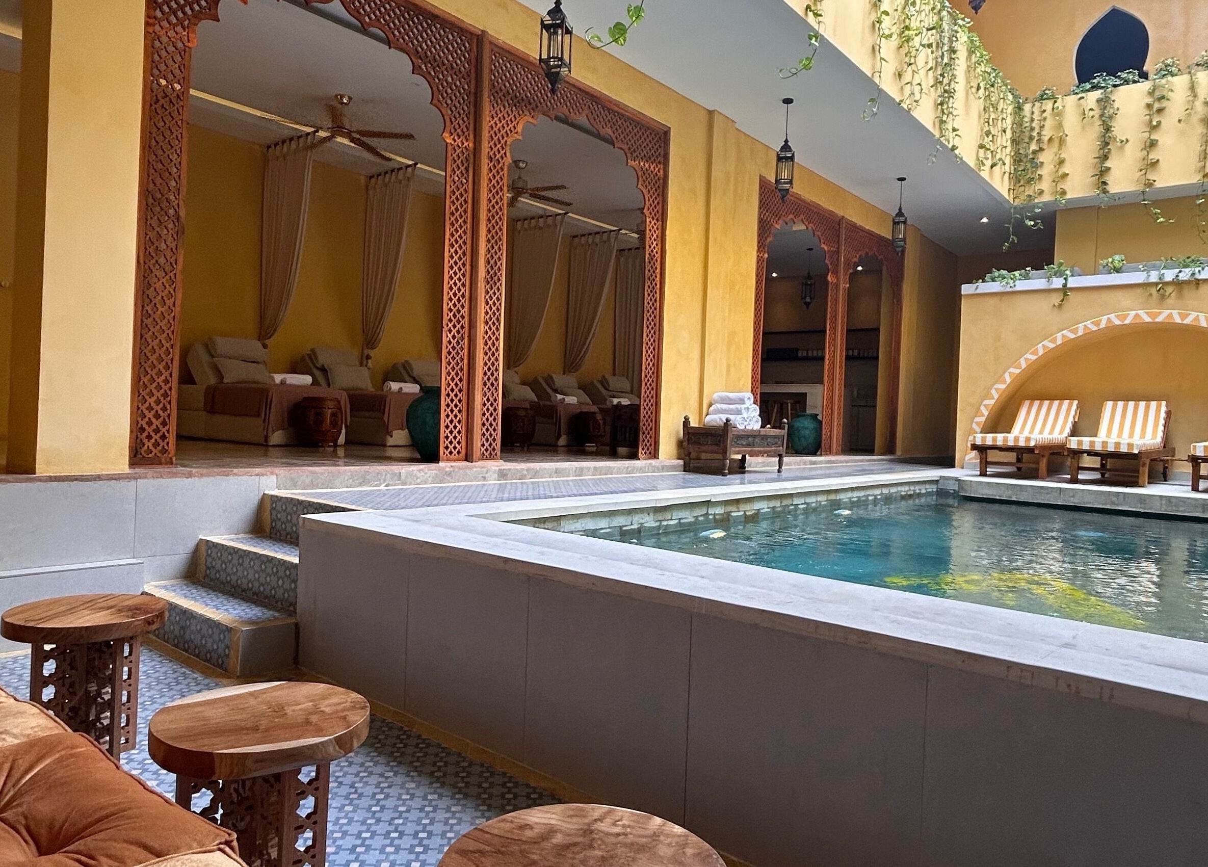 Luxurious poolside view at Limu Spa Moroccan in Bali, Bali, ID, showcasing elegant lounging areas and serene ambiance.