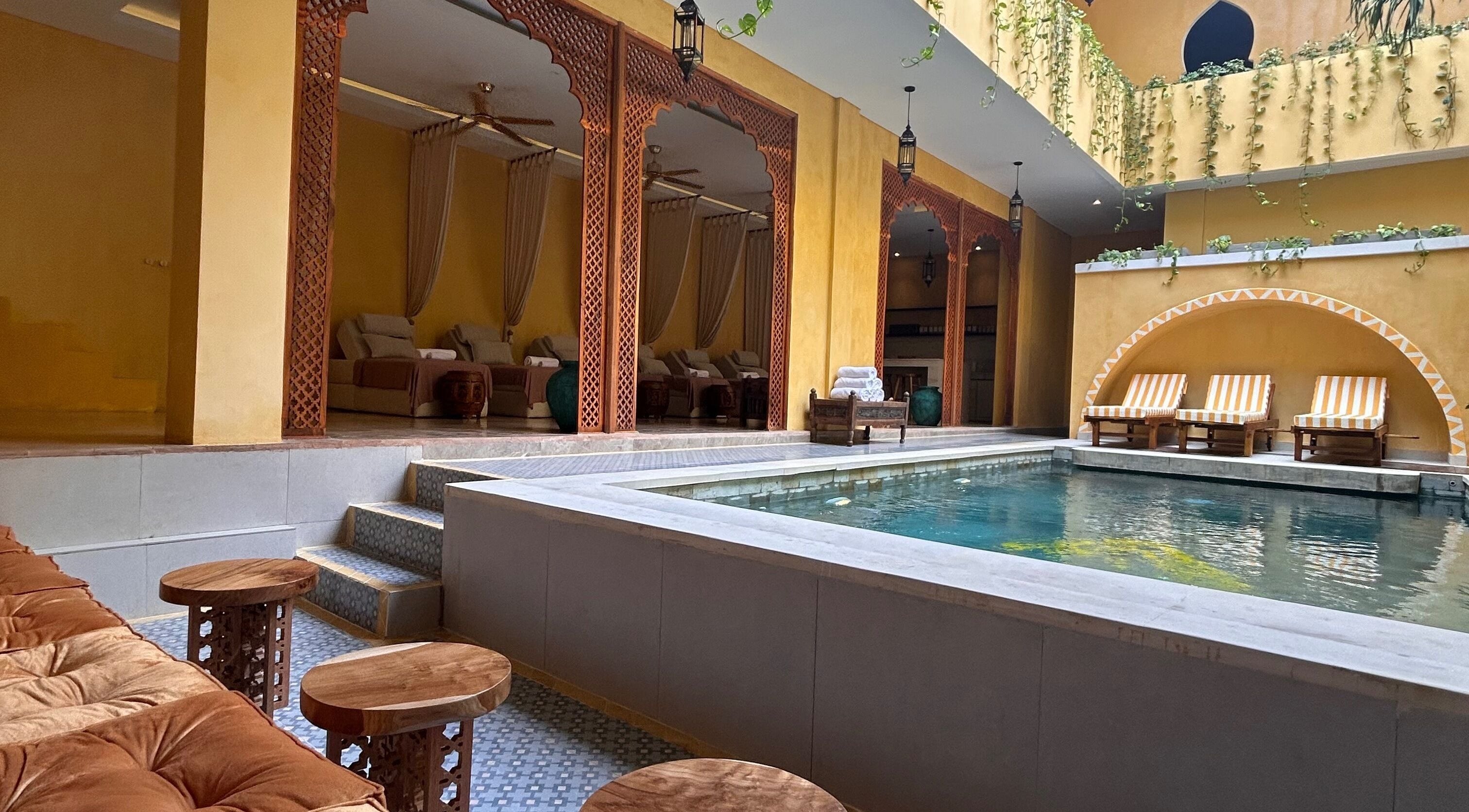 Luxurious poolside view at Limu Spa Moroccan in Bali, Bali, ID, showcasing elegant lounging areas and serene ambiance.