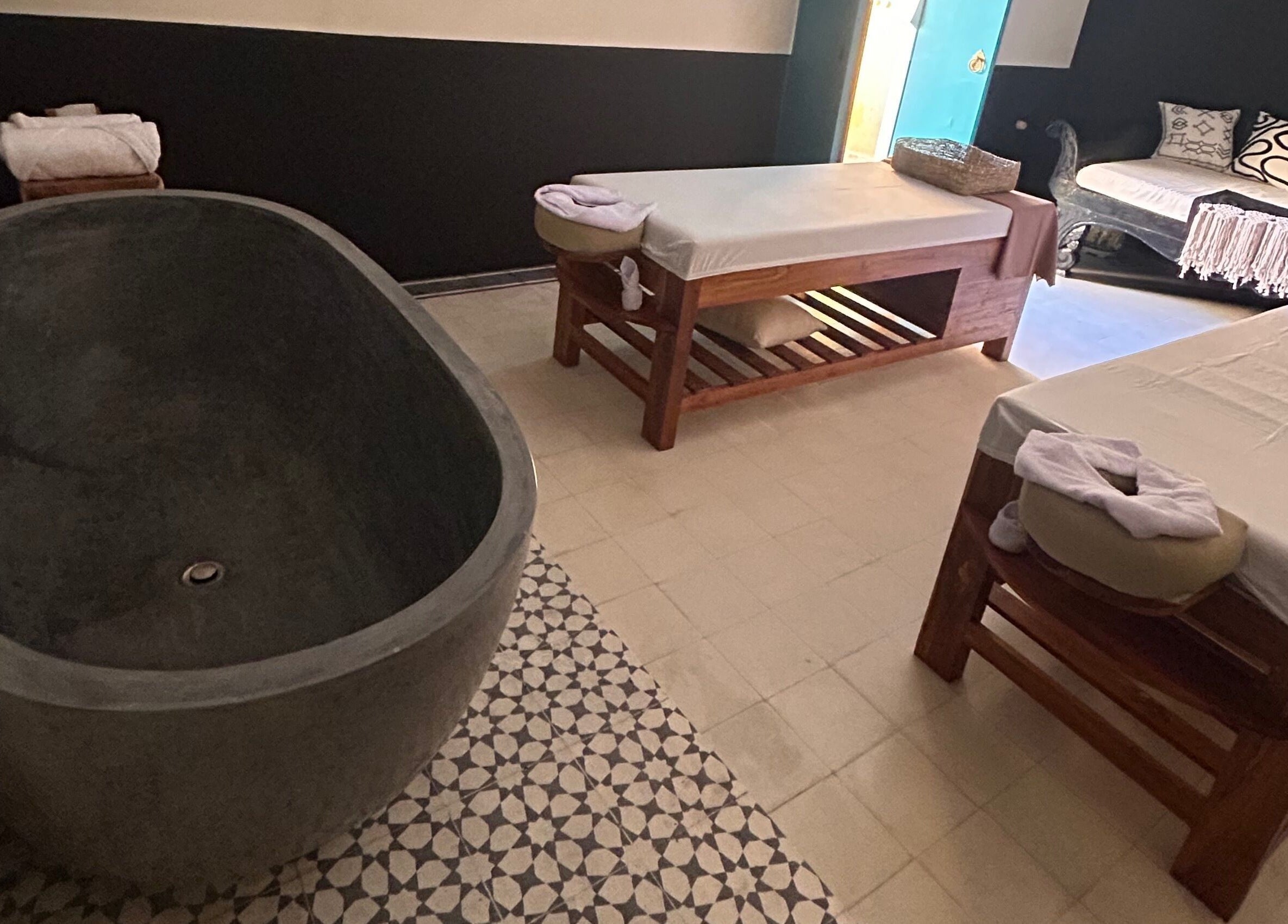 Elegant treatment room at Limu Spa Moroccan, Bali, Bali, ID with a luxurious spa bath and massage tables.