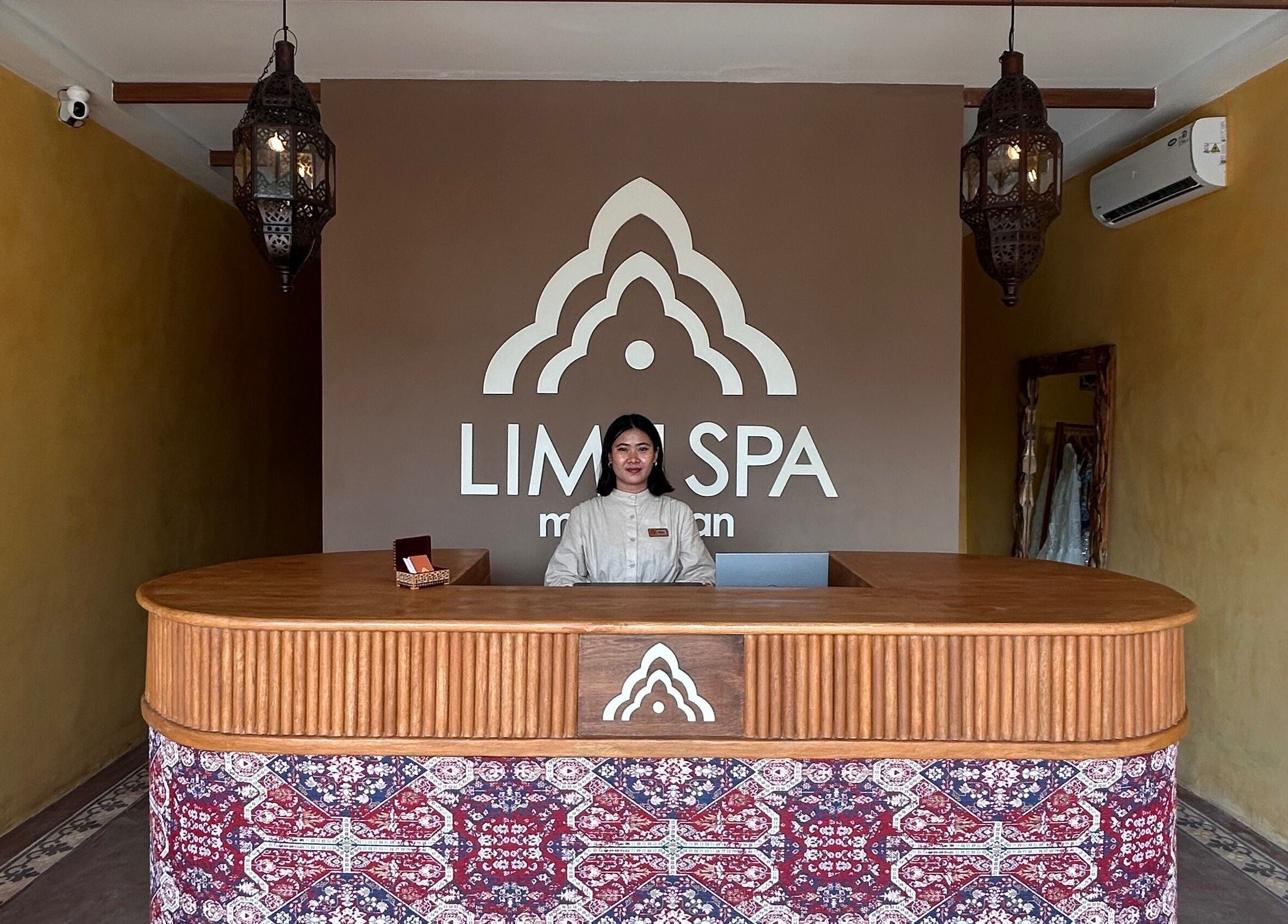 Reception at Limu Spa Moroccan in Bali, Bali, ID, featuring intricate decor and a welcoming staff member.