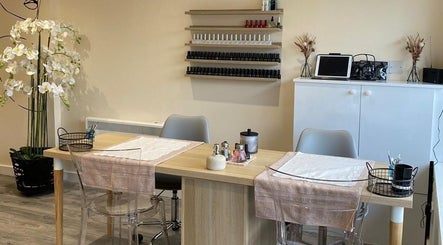 Modern nail care station at Pure Beauty in Holytown, Scotland, GB, showcasing elegant decor and relaxing ambiance.